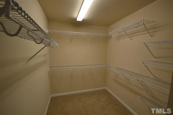 a view of a room with racks on the wall
