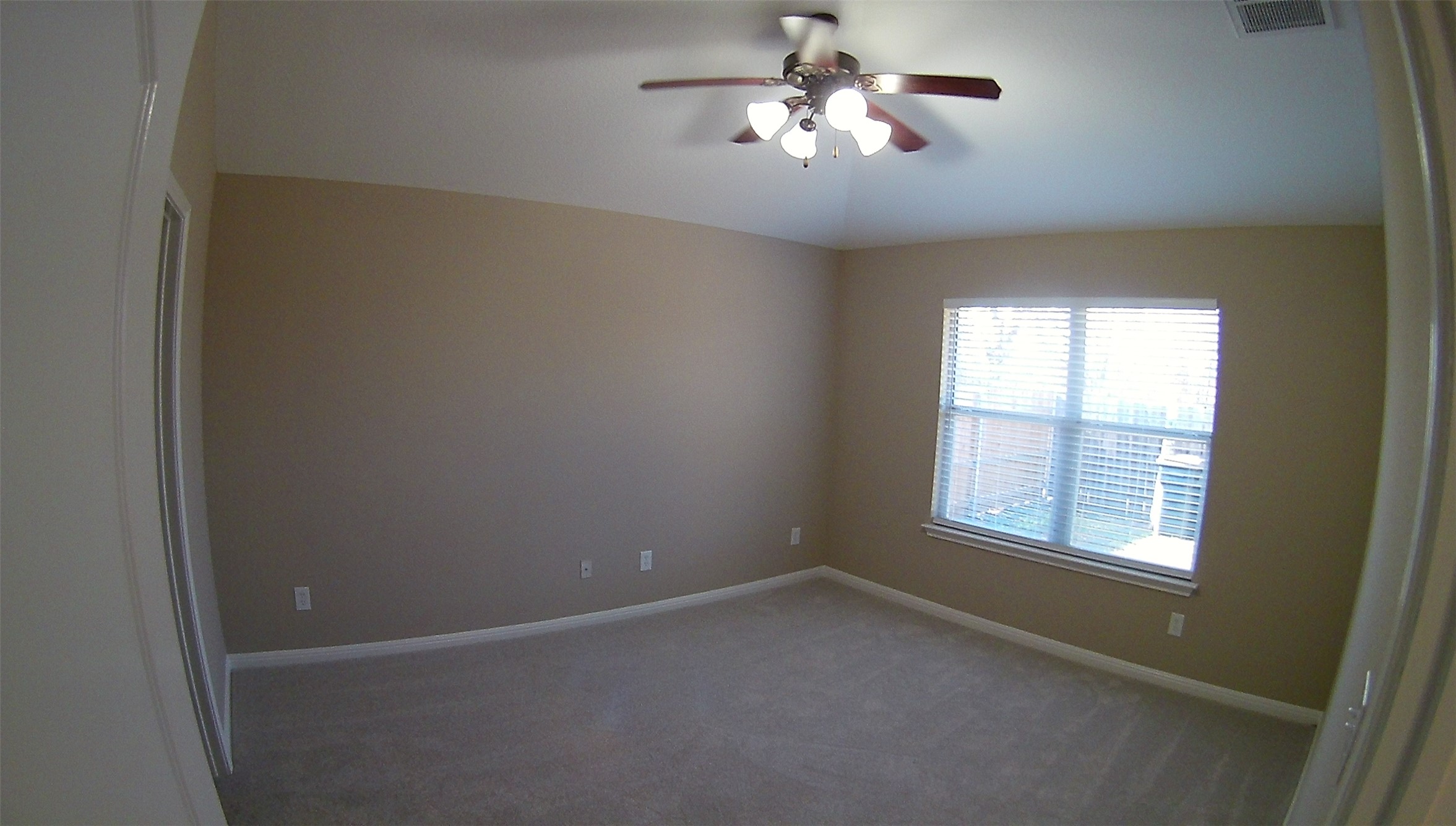 3304 Wickham Lane Austin, TX 78725 - Photo 4 of 13 Carpeted empty room featuring baseboards and ceiling fan