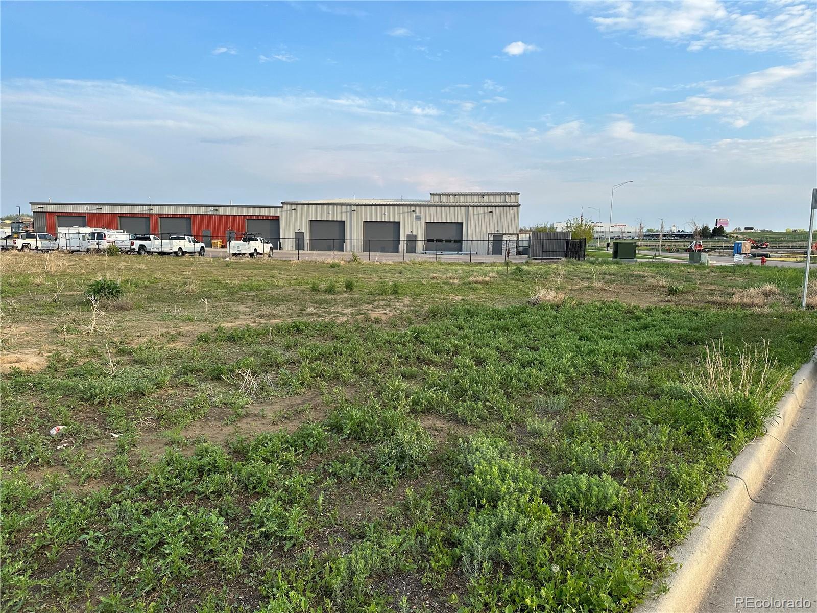 8360 Raspberry Way Frederick, CO 80504 - Photo 2 of 4 a front view of a house with a garden