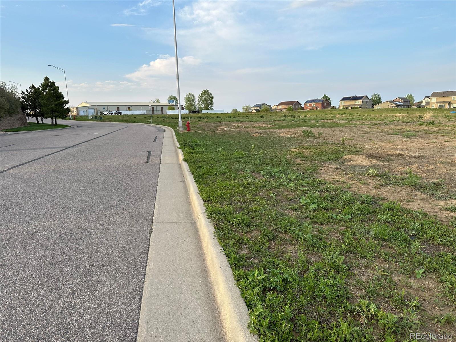 8360 Raspberry Way Frederick, CO 80504 - Photo 4 of 4 a view of a city street both side of a building