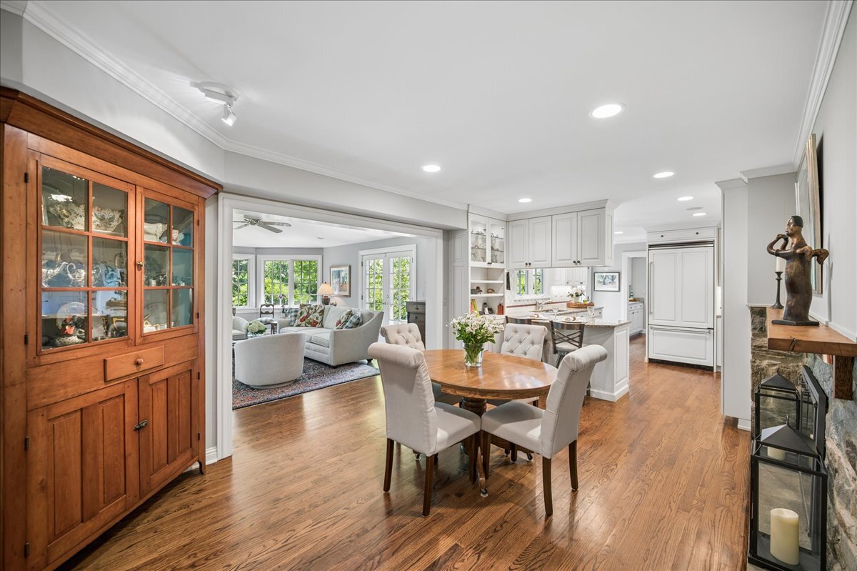 253 Summerfield Road Northbrook, IL 60062 - Photo 14 of 46 a view of a dining room with furniture window and wooden floor