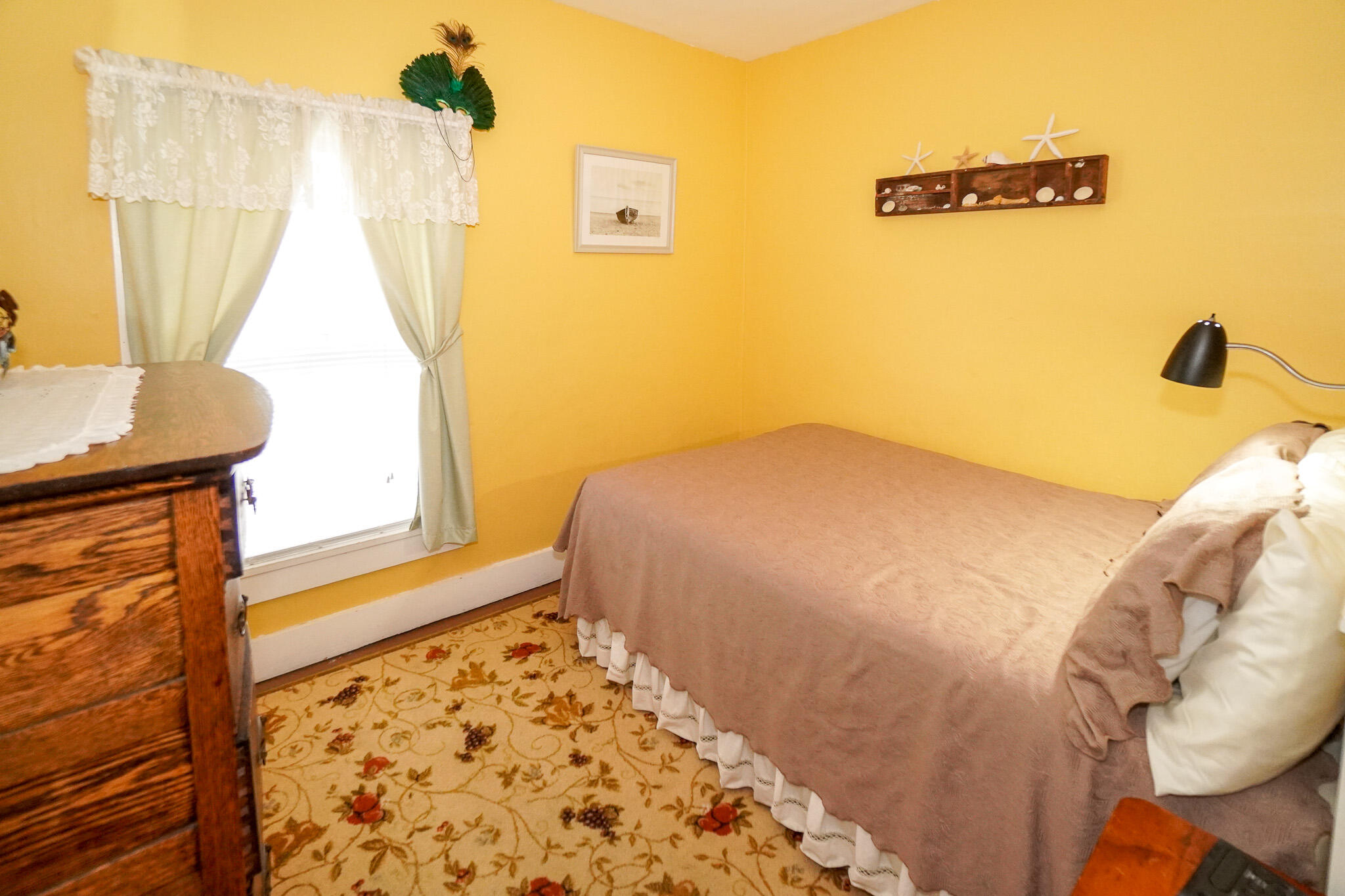 5 Tabernacle Avenue Oak Bluffs, MA 02557 - Photo 24 of 37 a bedroom with a bed and a window