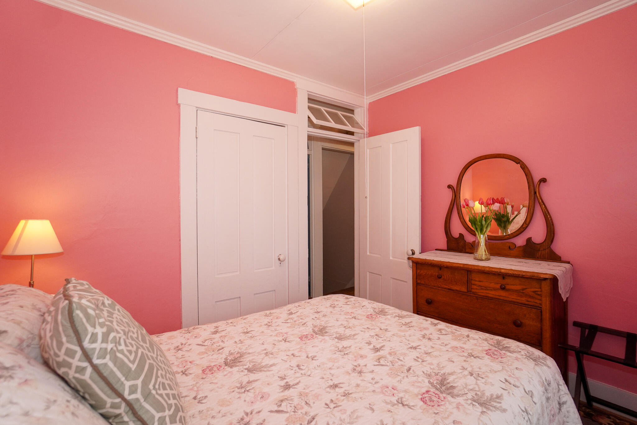 5 Tabernacle Avenue Oak Bluffs, MA 02557 - Photo 26 of 37 a bedroom with a bed and a lamp on dresser