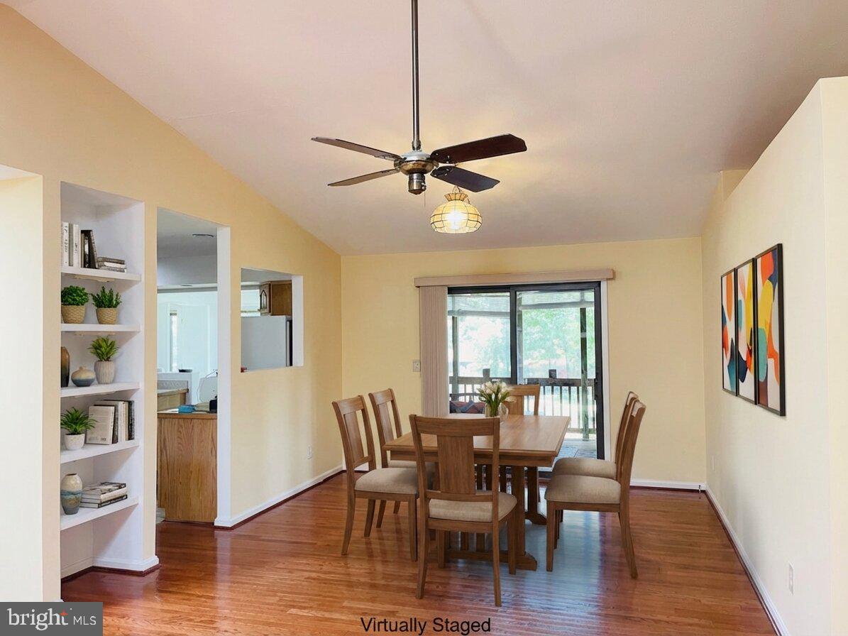 200 Pine Valley Road Locust Grove, VA 22508 - Photo 6 of 15 a view of a dining room with furniture window and wooden floor