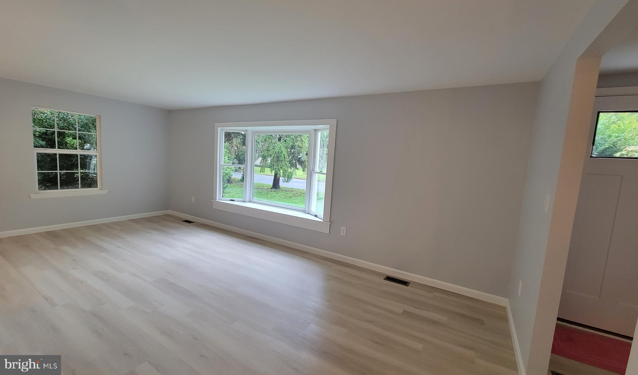 410 Spruce Street Milton, DE 19968 - Photo 2 of 8 an empty room with windows