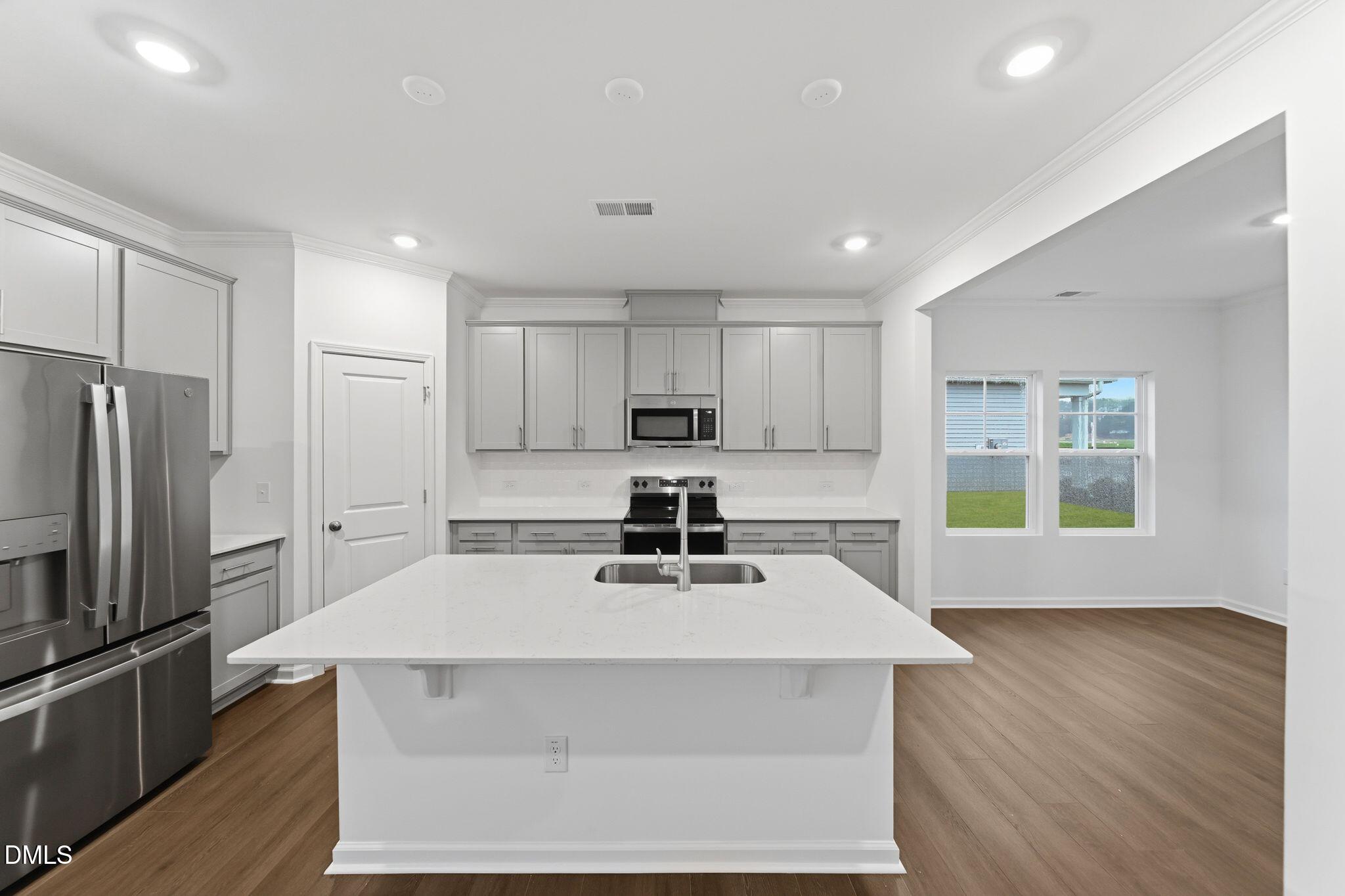 5842 Millstone Way Sims, NC 27880 - Photo 4 of 22 a kitchen with a appliances a sink and a microwave