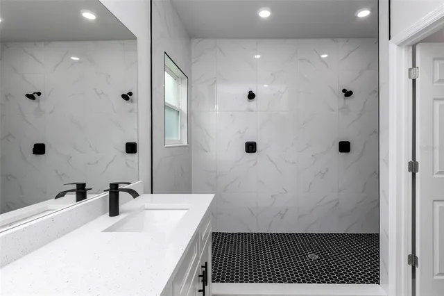 a bathroom with a sink and a mirror