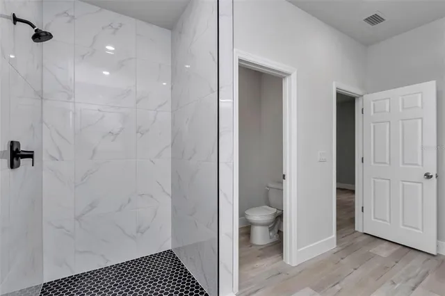 a bathroom with a sink and a shower