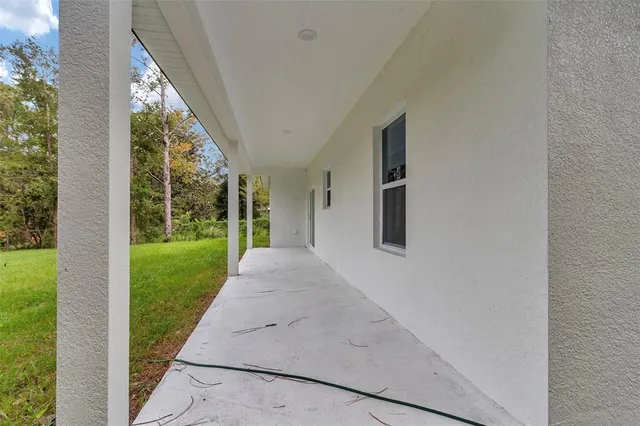a view of porch with a yard