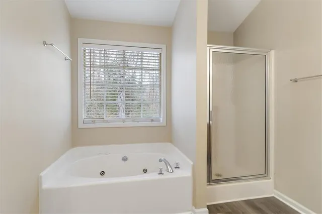 a white bath tub sitting next to a window