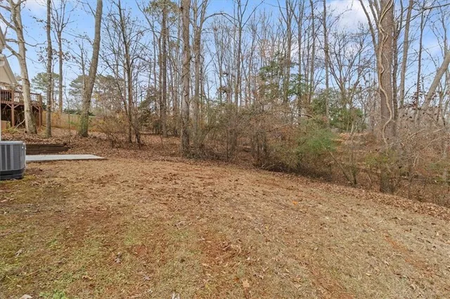 a view of a backyard of the house