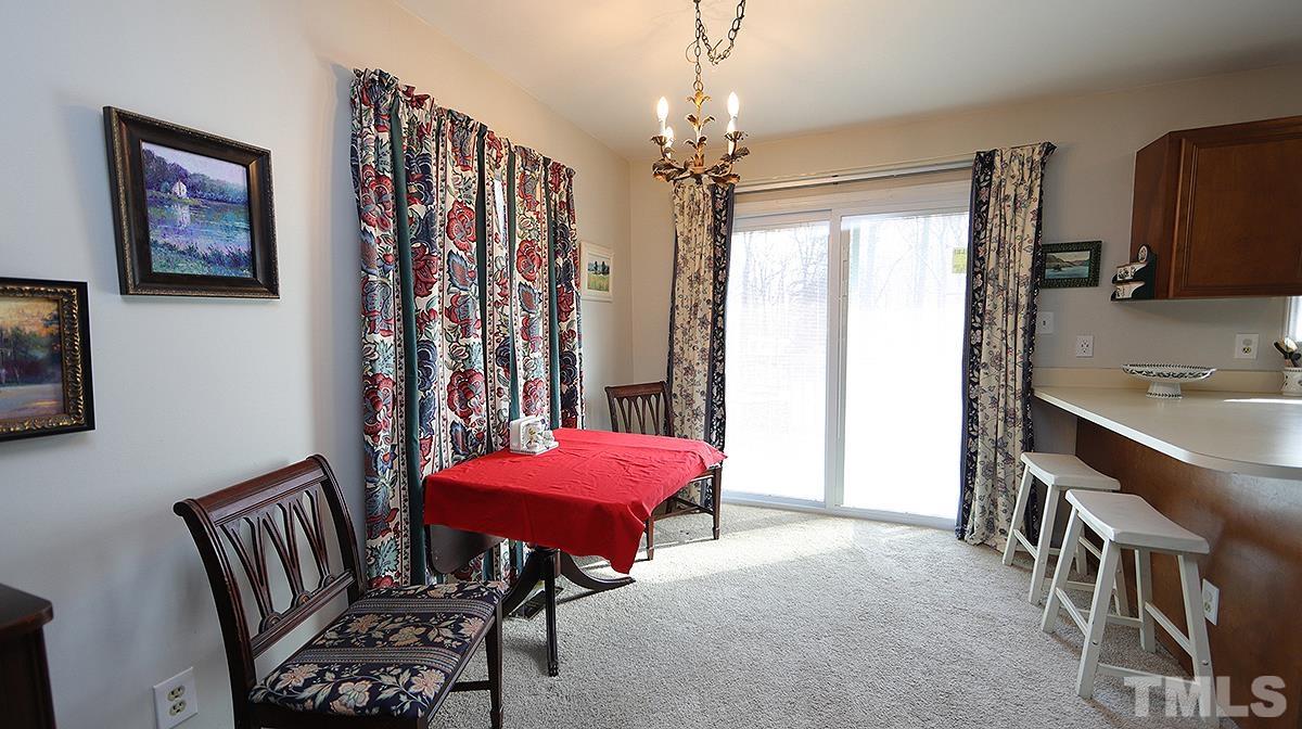 10633 Old Stage Road Raleigh, NC 27603 - Photo 5 of 20 a view of a livingroom with furniture and window