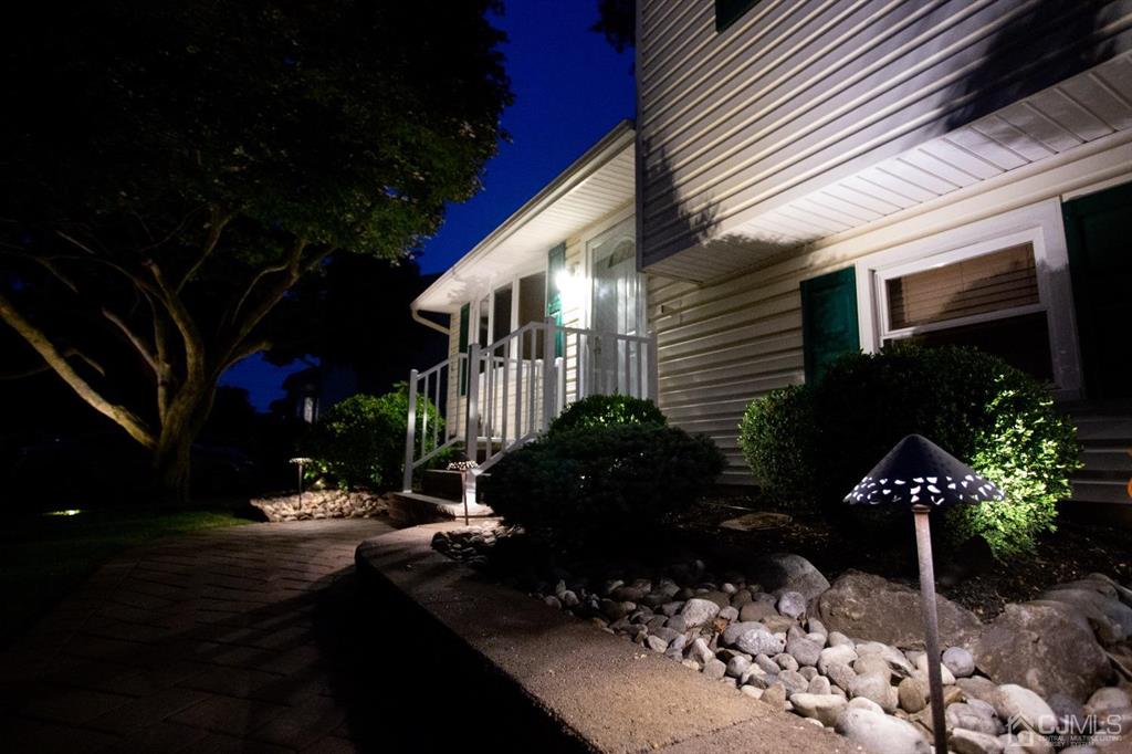 27 Finley Road Edison, NJ 08817 - Photo 54 of 57 a view of a house with a yard and a garden