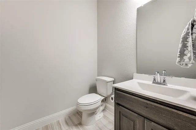 a open kitchen with a table and chairs