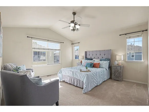 a bedroom with a bed dresser and a window