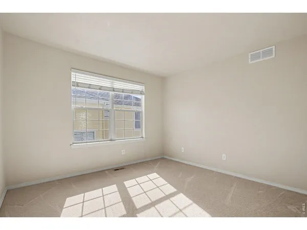 a view of an empty room and window