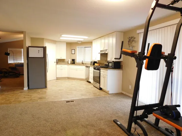 a view of a kitchen with furniture and a window