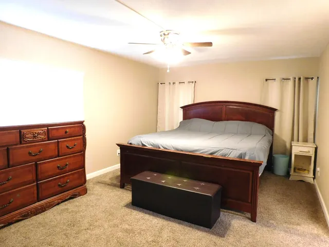 a room with furniture and a dresser