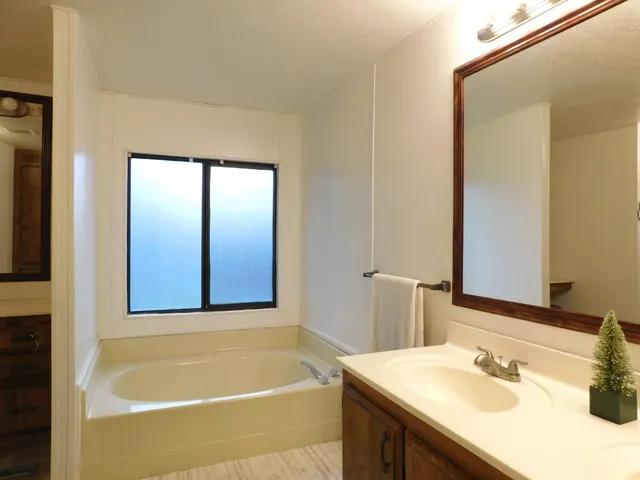 a bathroom with a bathtub and a sink