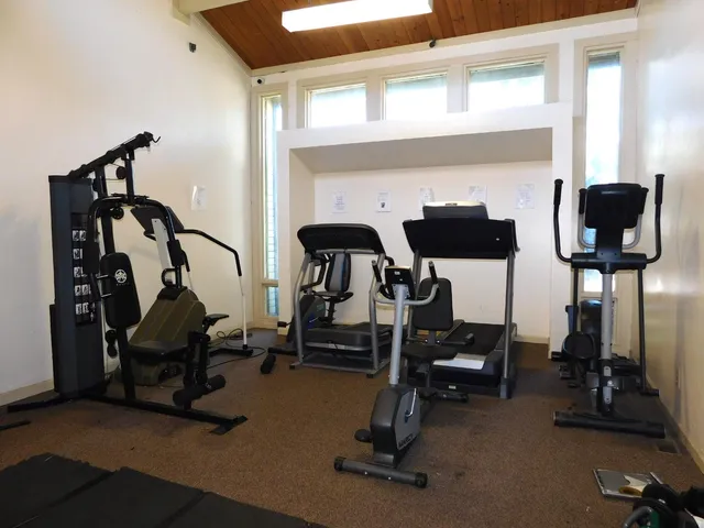 a view of a balcony with seating space