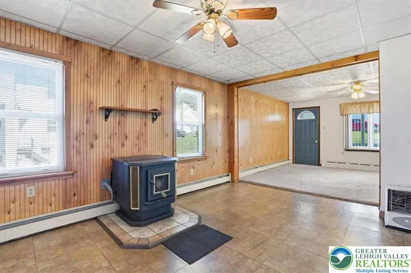 a bathroom with a toilet a sink and curtain