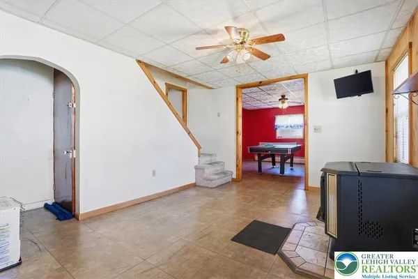 a kitchen with stainless steel appliances granite countertop a sink a stove and cabinets