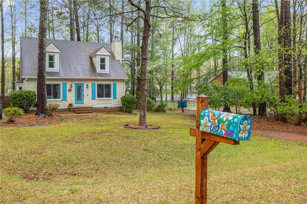 210 Shadow Moss Drive Athens, GA 30605 - Photo 1 of 1 a front view of a house with garden