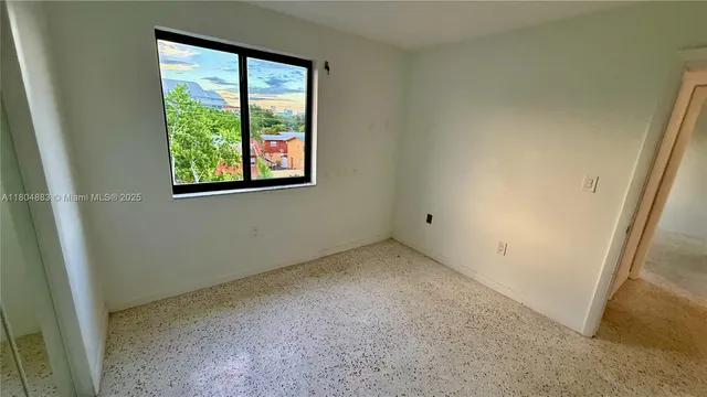 an empty room with windows