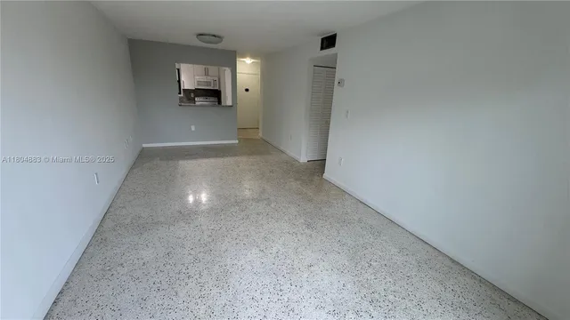 a view of a room that has a window