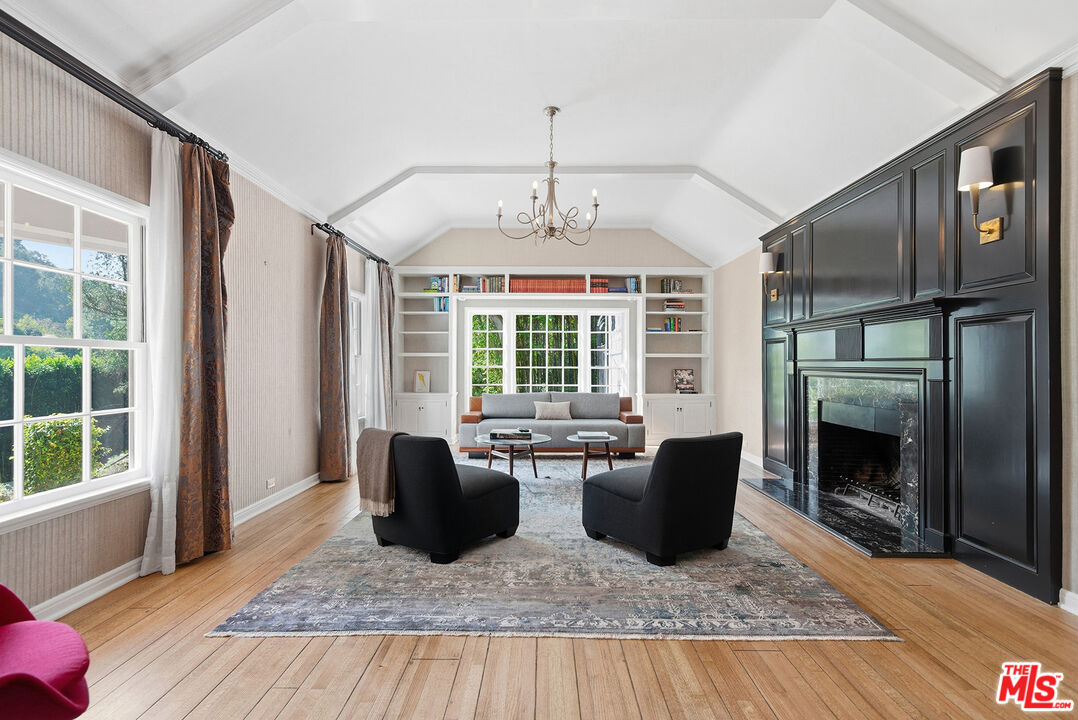 9305 Hazen Drive Beverly Hills, CA 90210 - Photo 12 of 59 a living room with furniture windows and a fireplace