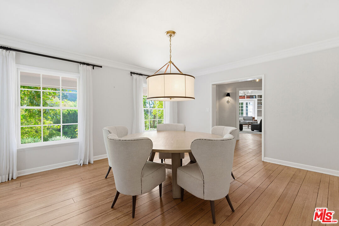 9305 Hazen Drive Beverly Hills, CA 90210 - Photo 18 of 59 a view of a dining room with furniture window and wooden floor