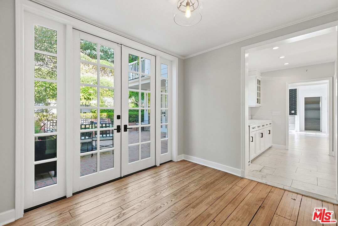 9305 Hazen Drive Beverly Hills, CA 90210 - Photo 19 of 59 a view of a big room with wooden floor and windows
