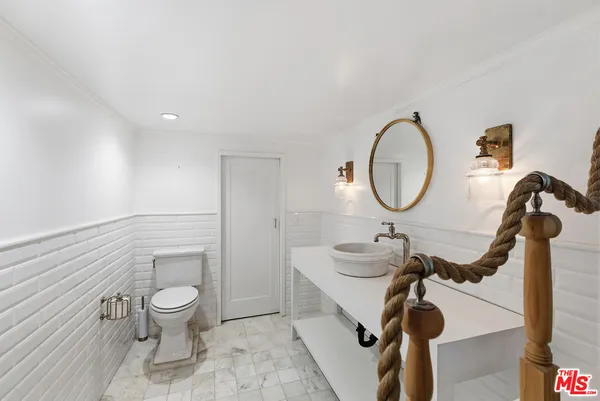 a spacious bathroom with a double vanity sink a mirror and a shower