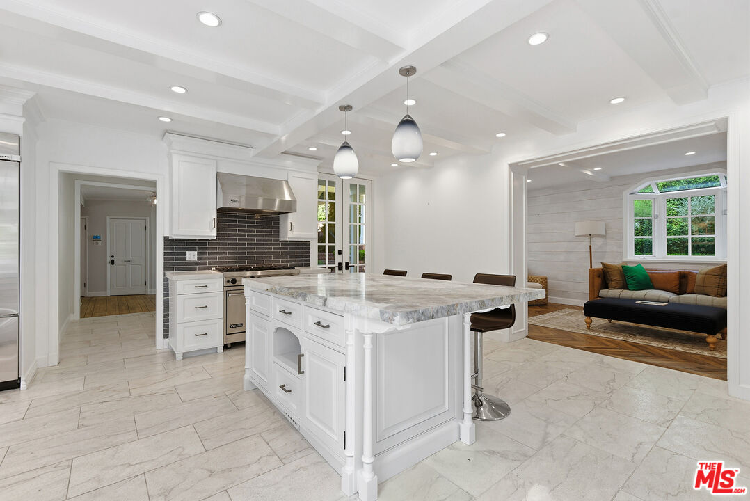 9305 Hazen Drive Beverly Hills, CA 90210 - Photo 24 of 59 a kitchen with stainless steel appliances granite countertop a stove and a sink