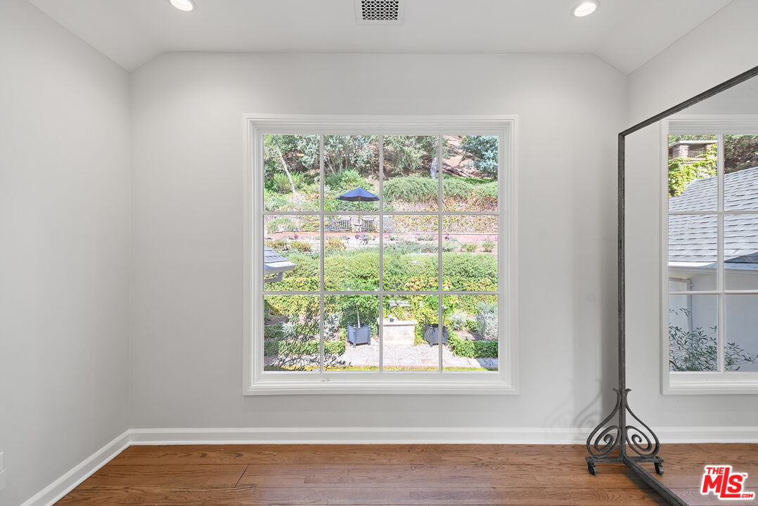 9305 Hazen Drive Beverly Hills, CA 90210 - Photo 37 of 59 a view of empty room with wooden floor and fan