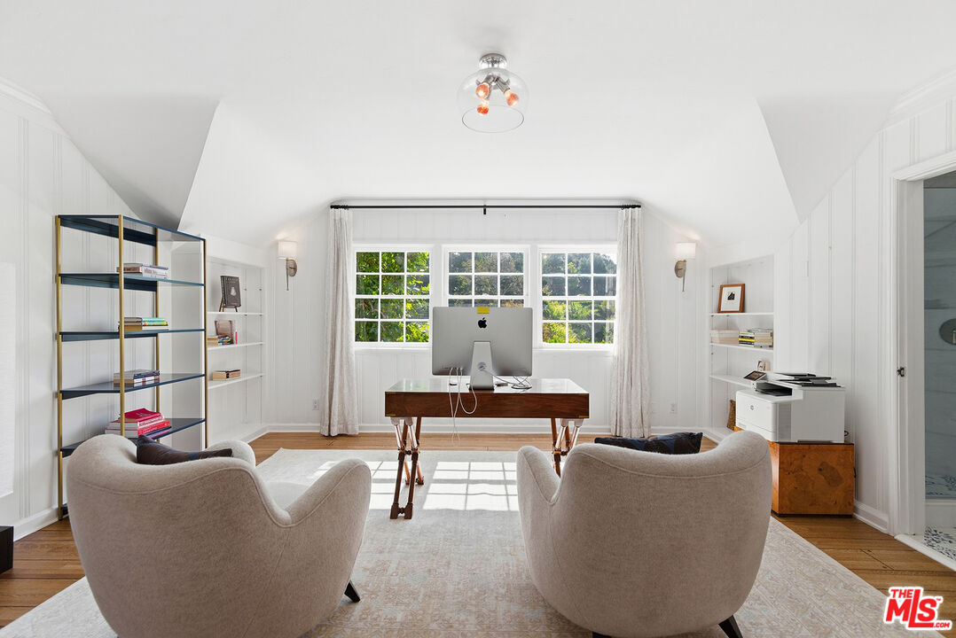 9305 Hazen Drive Beverly Hills, CA 90210 - Photo 38 of 59 a living room with furniture and a window