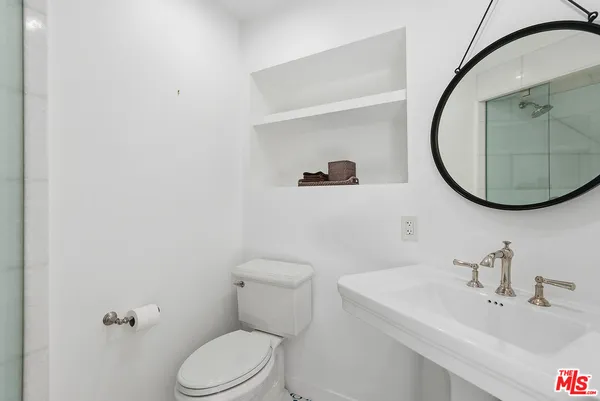a bathroom with a sink and a shower