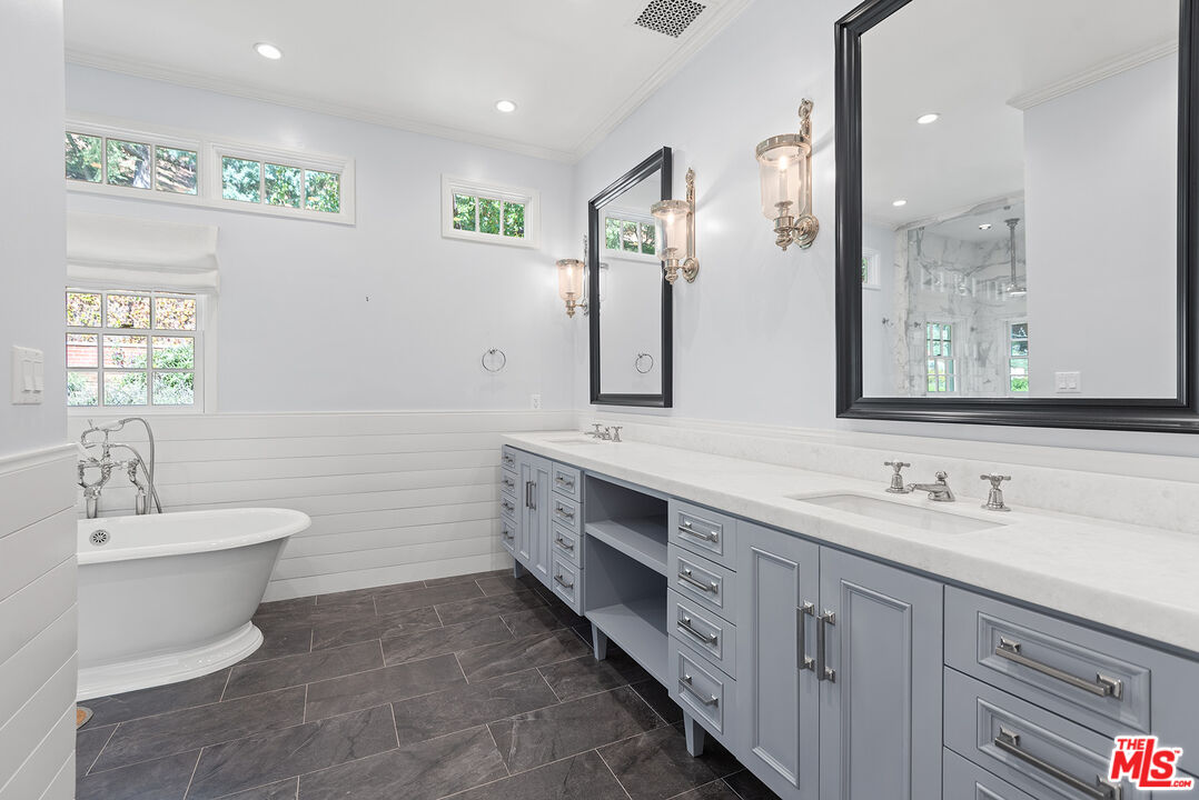 9305 Hazen Drive Beverly Hills, CA 90210 - Photo 43 of 59 a bathroom with a double vanity sink mirror and toilet