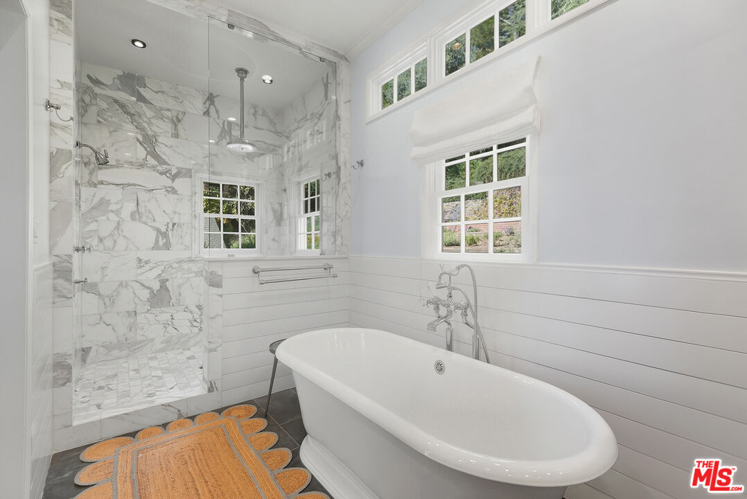 9305 Hazen Drive Beverly Hills, CA 90210 - Photo 44 of 59 a bathroom with a bathtub and a shower