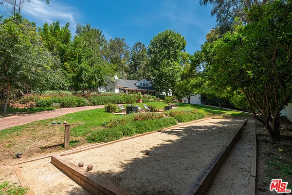 a big yard with large trees