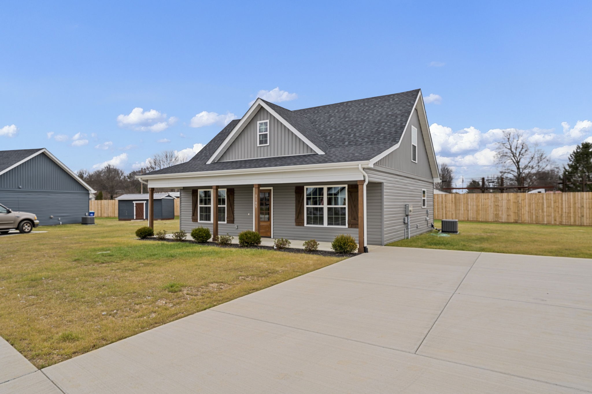 1105 Brook Court Franklin, KY 42134 - Photo 2 of 27 a front view of a house with a yard and garage