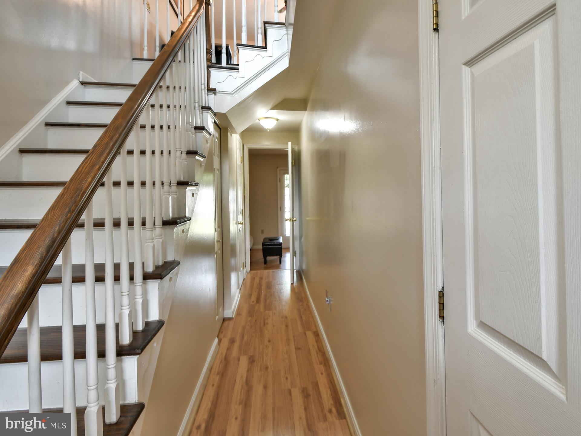 42 Victoria Square Frederick, MD 21702 - Photo 33 of 43 a view of staircase with lots of frames on wall and wooden floor