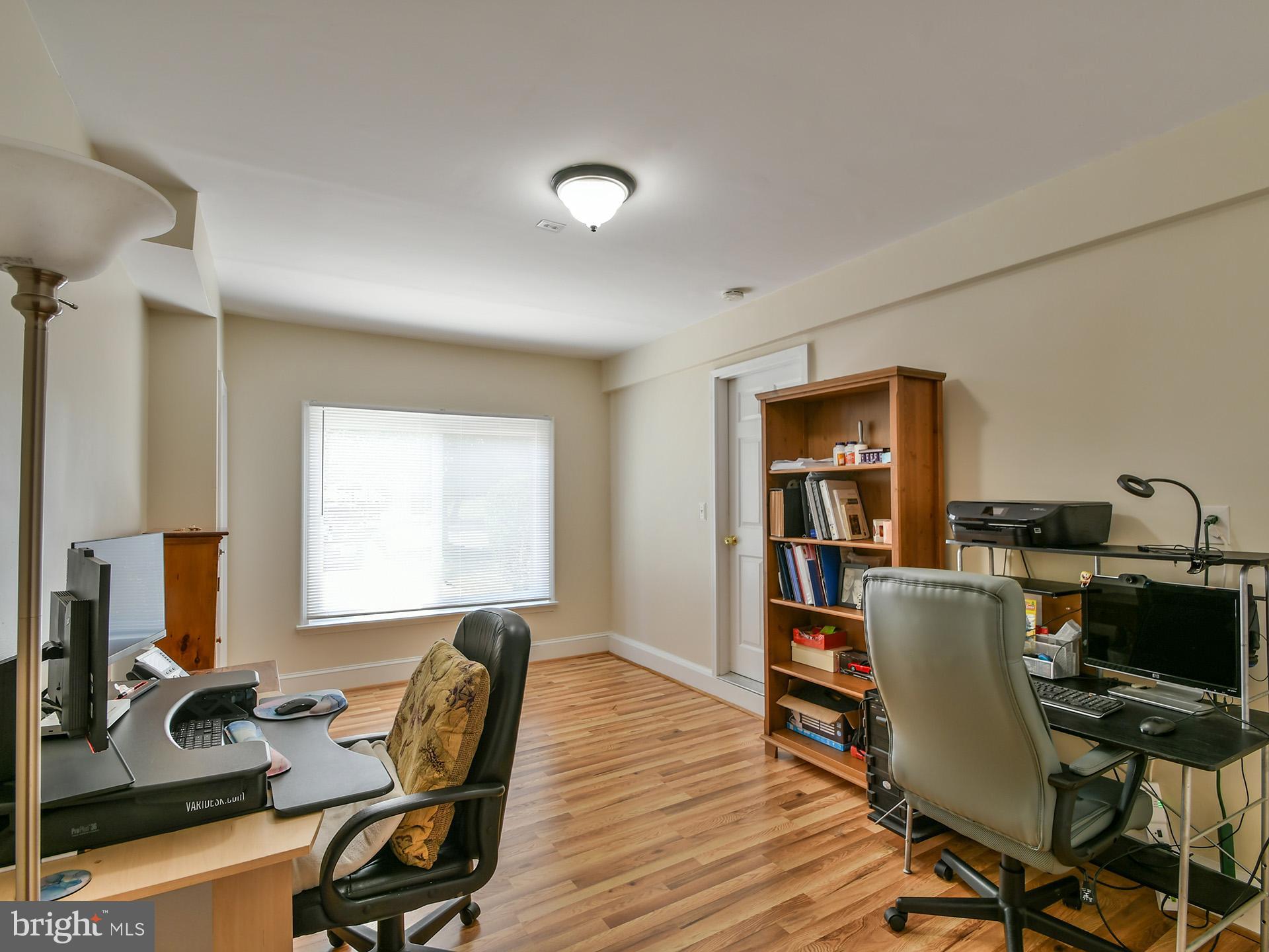 42 Victoria Square Frederick, MD 21702 - Photo 42 of 43 a view of a workspace with furniture and a window