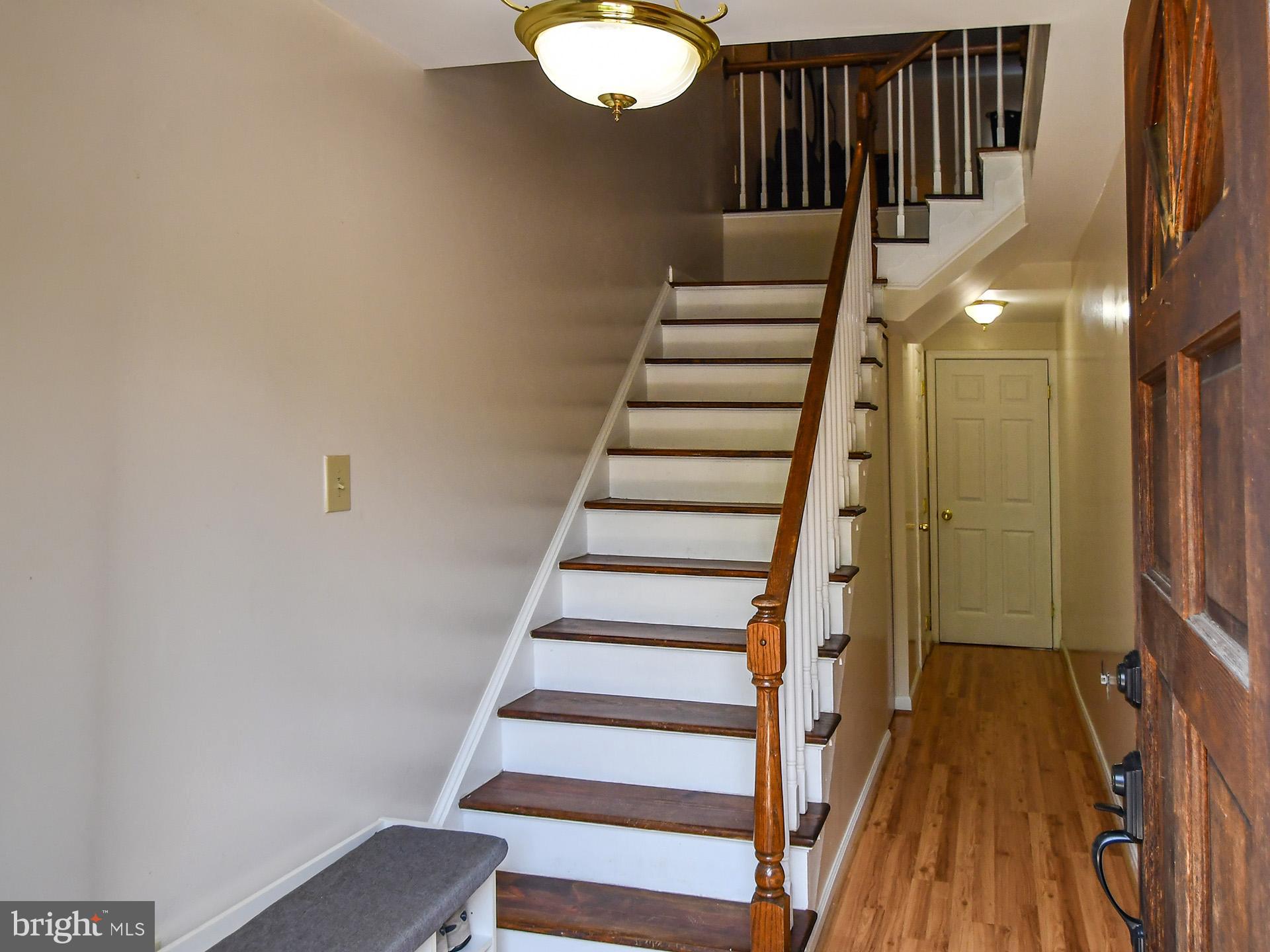 42 Victoria Square Frederick, MD 21702 - Photo 8 of 43 a view of entryway with wooden floor and stairs