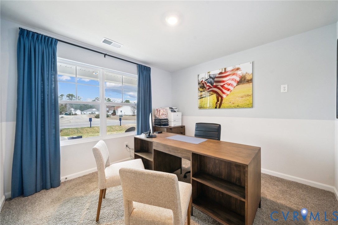 1798 River Vista Road Hopewell, VA 23860 - Photo 4 of 21 a view of a dining room with furniture a chandelier and wooden floor