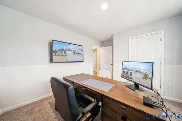 a view of a workspace with furniture