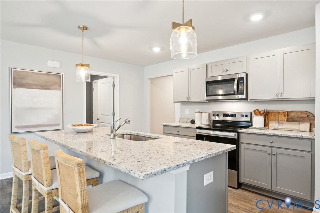 1798 River Vista Road Hopewell, VA 23860 - Photo 6 of 21 a kitchen with granite countertop kitchen island cabinets and a sink