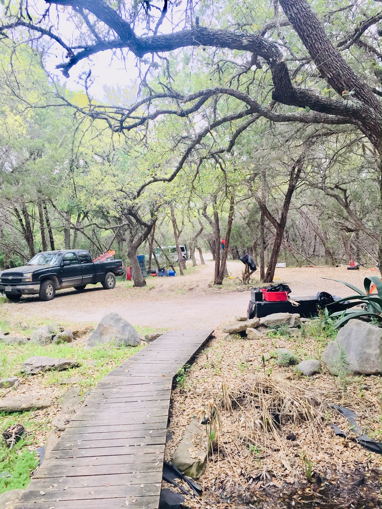 1850 North Rainbow Ranch Road Wimberley, TX 78676 - Photo 13 of 26 a view of street with large trees