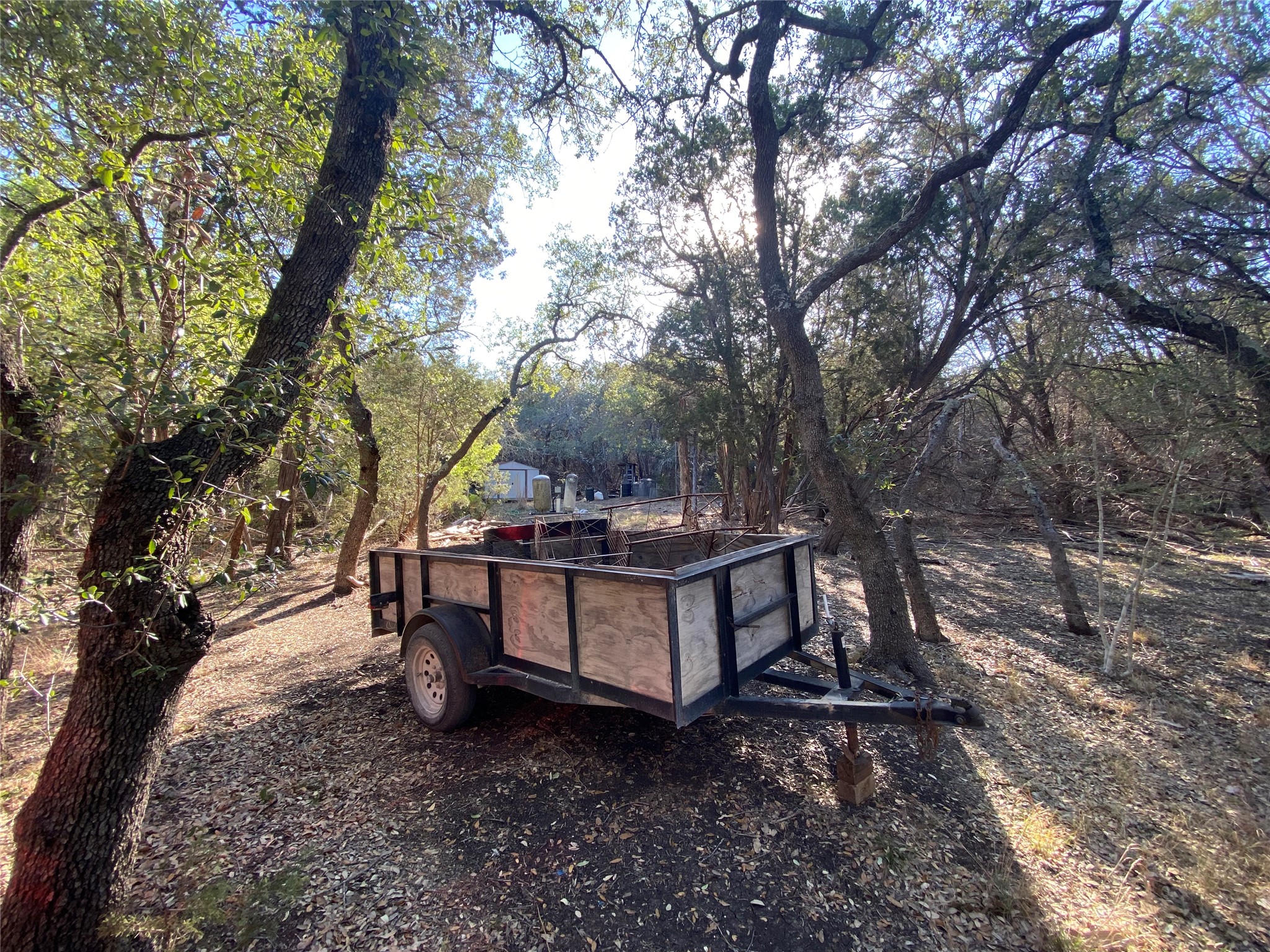 1850 North Rainbow Ranch Road Wimberley, TX 78676 - Photo 26 of 26 a view of a bench in the backyard