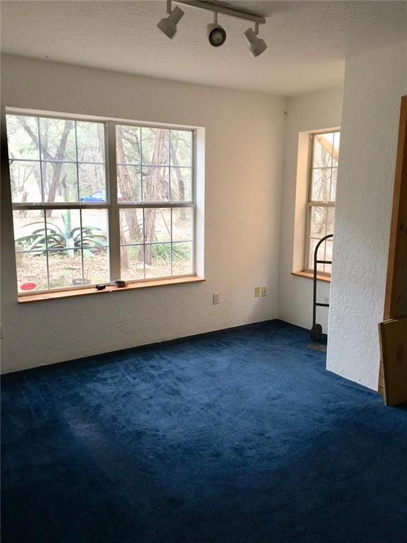 1850 North Rainbow Ranch Road Wimberley, TX 78676 - Photo 7 of 26 an empty room with a window